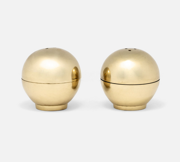 Two spherical metallic Helios Salt & Pepper Shaker Set shakers with small pouring holes on top.