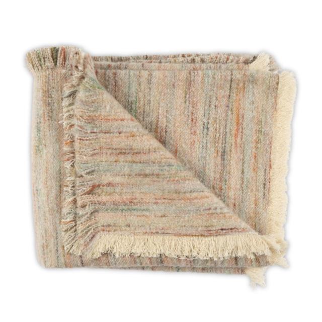 A folded Moss Studio Nest Frayed Throw in Petal, measuring 53 x 90 inches, features multicolored stripes, a textured finish, and fringed edges, displayed against a white background.