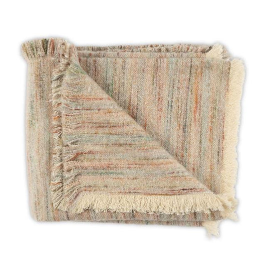 A folded Moss Studio Nest Frayed Throw in Petal, measuring 53 x 90 inches, features multicolored stripes, a textured finish, and fringed edges, displayed against a white background.