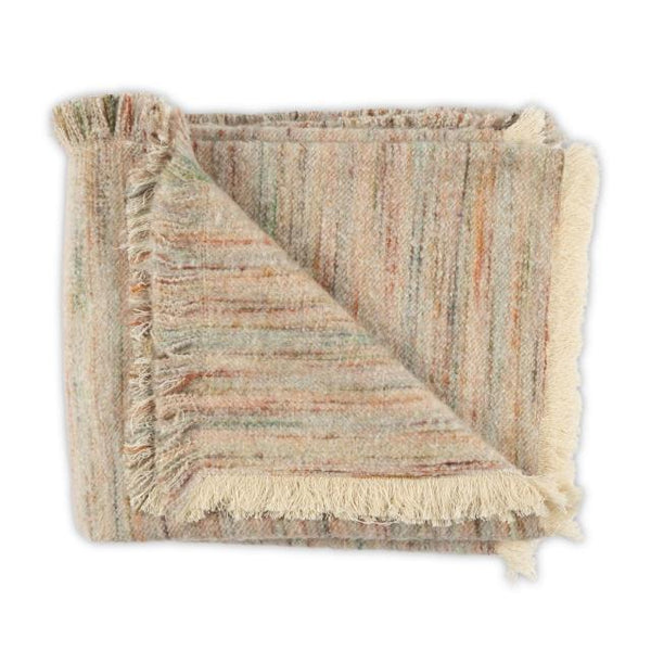 A folded Moss Studio Nest Frayed Throw in Petal, measuring 53 x 90 inches, features multicolored stripes, a textured finish, and fringed edges, displayed against a white background.