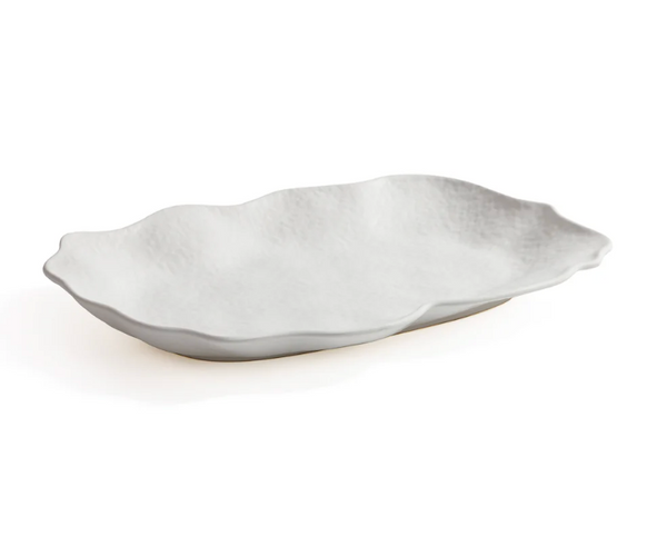 The Zodax Alto Rectangle Ceramic Platter features a white, textured surface and gently wavy, irregular edges—ideal as a centerpiece. Shown on a plain white background.