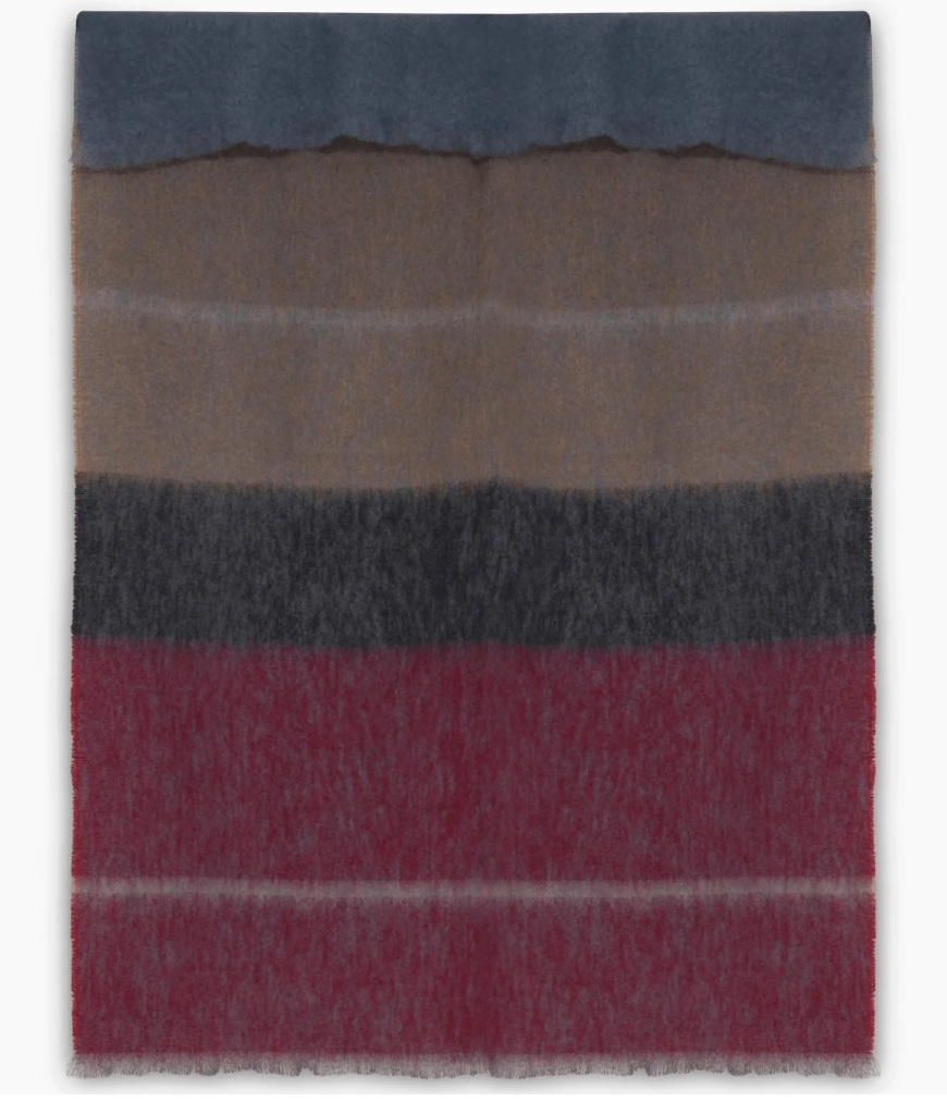 The Boher Extra Large Throw is a hand-finished luxury mohair blanket featuring soft-textured, wide horizontal stripes in shades of blue, brown, dark gray, and deep red.
