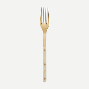 The Sabre Bistro Horn Serving Fork features a shiny gold finish and glossy light ivory handle with three brass rivets, made in France, shown against a plain white background.