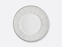 The Silva Dinnerware Serving Pieces by Bernardaud feature a white plate with a light gray sunburst pattern, adding sophisticated elegance to any table setting.