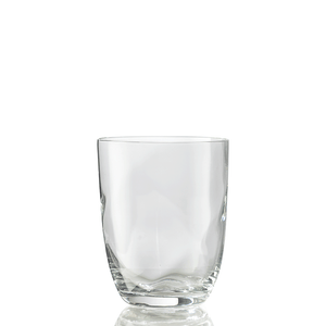 The Idra Tumbler Lente by Nason Moretti is shown upright on a white background, its clear glass reflecting light at the base.
