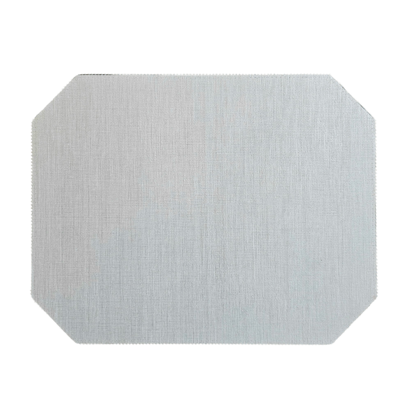 A rectangular light gray placemat from Julian Mejia’s Bespoke Double Sided Emerald Cut Rectangle set features slightly rounded, clipped corners and a subtle textured pattern.