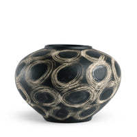 The Wren Vase - Black by FlowDecor Inc. is a round black ceramic vase with a narrow opening, featuring bold swirling cream circles—an eye-catching accent for any decor.