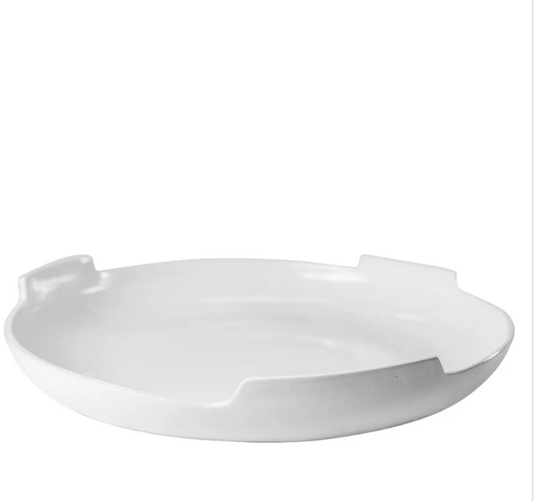 A white, high-fired “Ceramic Serveware - Platter 793 20”“ by Montes Doggett is shown from a low angle against a plain white background.