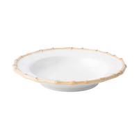 The Juliska Bamboo Dinnerware cake plate is white ceramic with a shallow bowl shape, a rim resembling natural bamboo, and sits on a small circular base.
