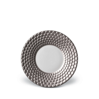 An Aegean Filet Platinum dinner plate in white fine porcelain with a wide, metallic silver rim featuring a raised, dimpled texture.