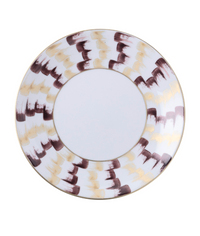 The Marie Daâge Zephyr 1 Dinnerware by Marie Daâge is a round porcelain plate with a wide rim, hand-painted in alternating brown, beige, and gold brushstrokes on white. The center of the plate is plain white.