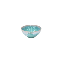 Taormina Aqua Dinnerware round, shallow turquoise bowl with a white drip-glaze pattern around the rim.