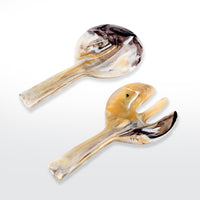 The Nashi Home Swirl Colored Resin Jumbo Servers include a spoon and fork, crafted with marbled brown, white, black, and beige resin, displayed on a light background.