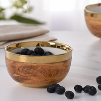 Madera Gold Snack Bowl with gold embellished rim with blueberries on top. 
