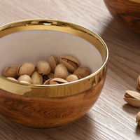 Madera Gold Snack Bowl with gold embellished rim with pistachios.