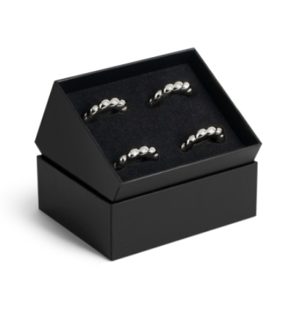 Set of four silver-toned, shell-inspired L’Objet Jessica McCormack Shell Napkin Ring Set of4 - Platinum presented in an open black luxury gift box.