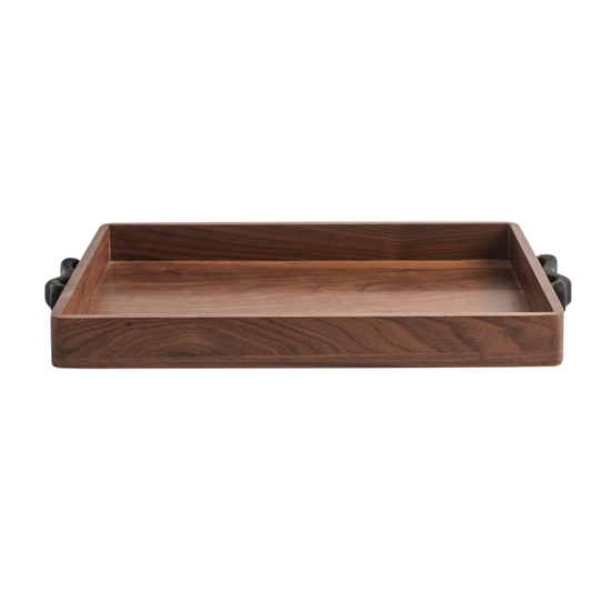 The Terreno Rectangle Marble Handled Tray by Greg Natale features a quality wood build, raised edges, and sleek black handles, making it a stylish rectangular serving tray perfect for display.