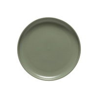 A round, plain, matte gray ceramic plate from the Casafina/Costa Nova Pacifica Dinnerware Artichoke collection is shown from above on a white background, highlighting the understated elegance of luxury tableware.