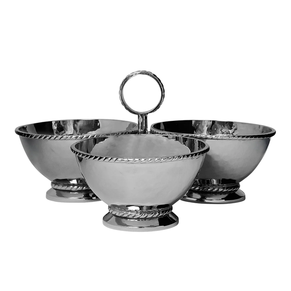The Juliska Graham Triple Cocktail Bowl features three hammered stainless steel serving bowls with decorative rims; the front bowl has a circular handle, while the two behind do not—an elegant entertaining piece.