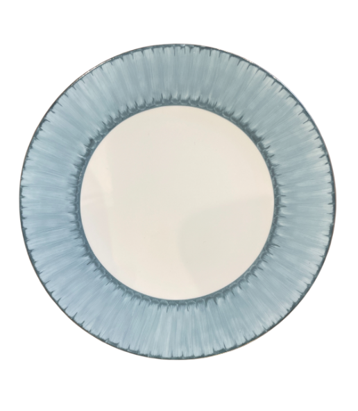 The Marie Daâge Ruban 1 Dinnerware by Marie Daâge features a round ceramic plate with a white center and a textured light blue, radial-patterned rim, shown from above against a white background.