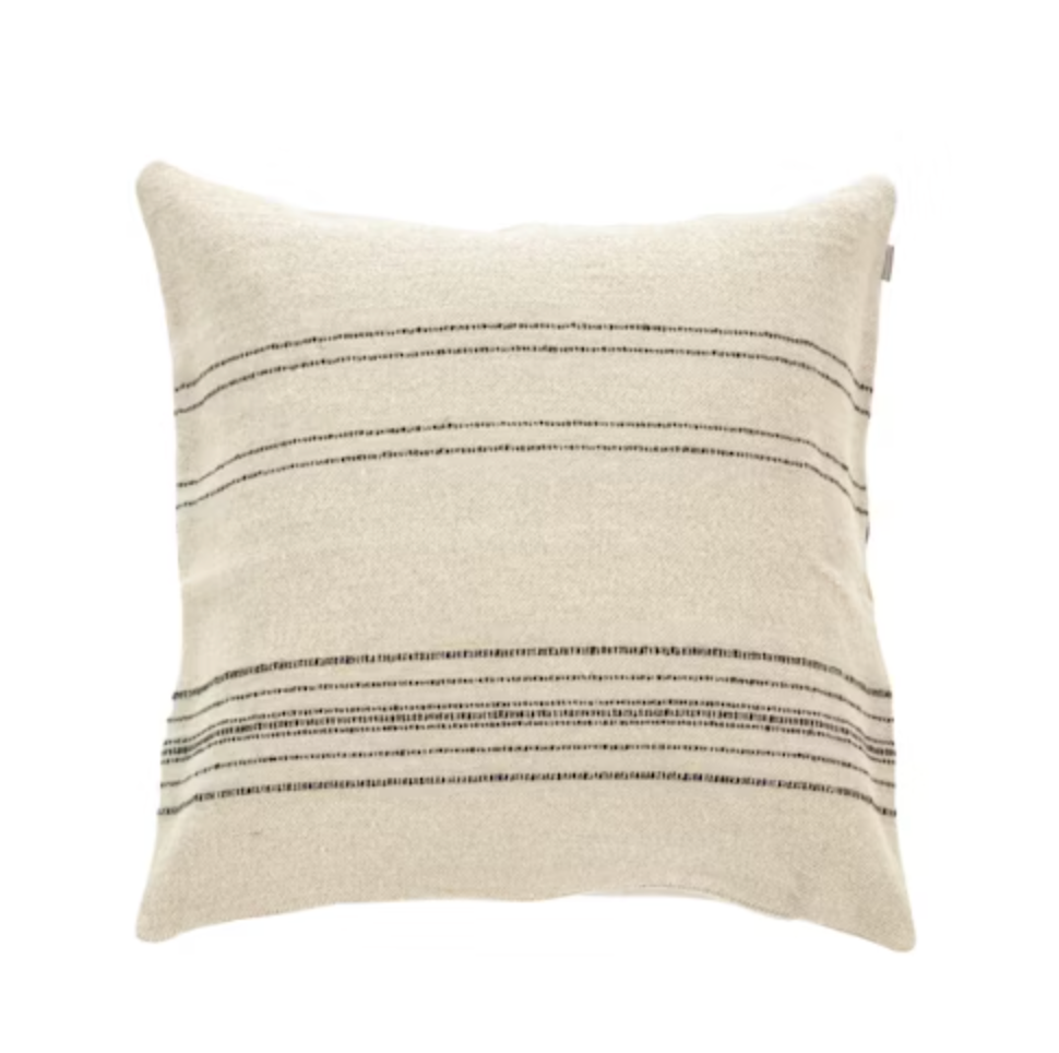 The Moroccan Stripe Pillow by Libeco Home features a square beige design with thin, evenly spaced horizontal black stripes, resembling a classic Moroccan coverlet, shown on a white background.