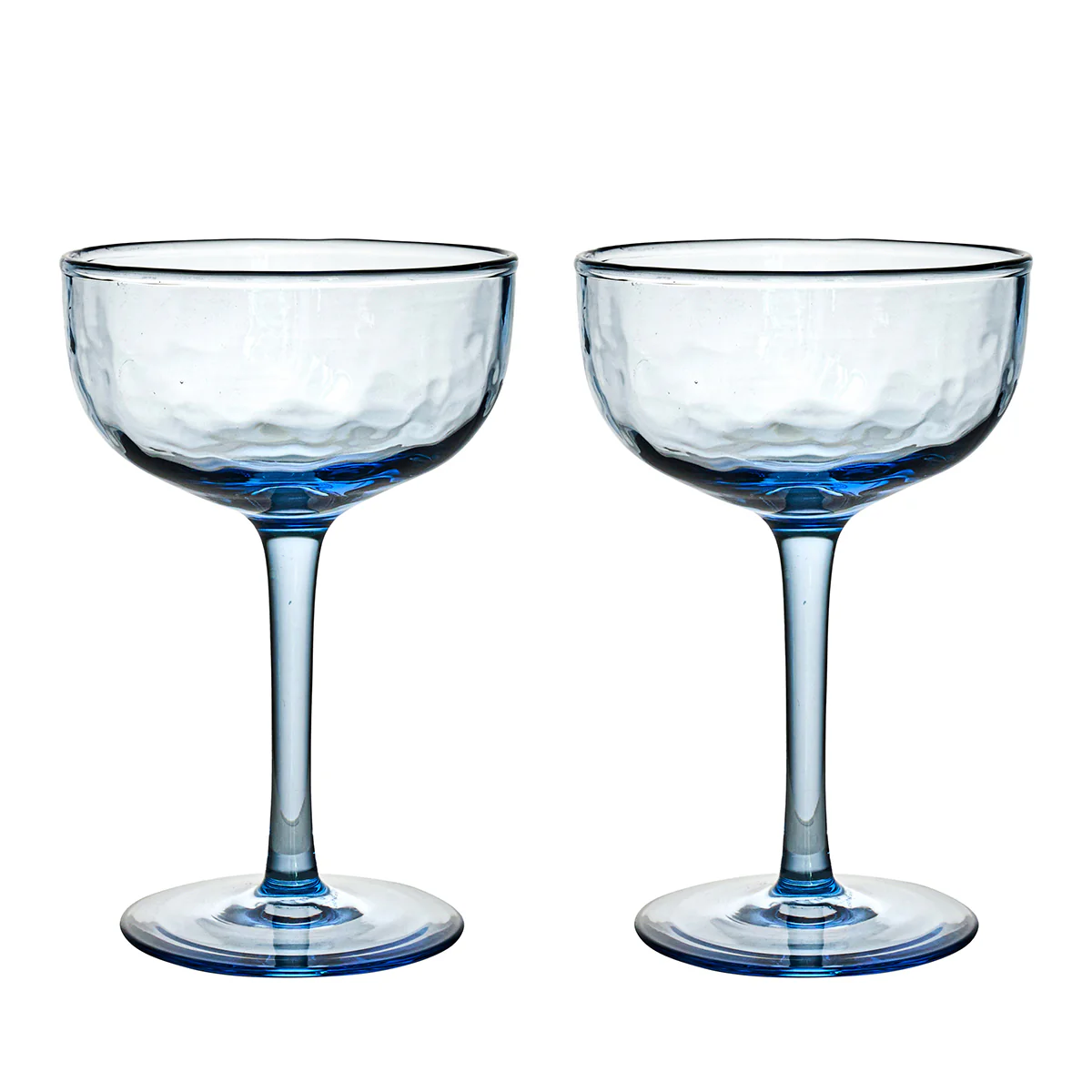 Two Puro Cocktail Coupe S/2 glasses by Juliska, featuring clear blue-tinted, textured bowls and slender stems, stand side by side against a white background—perfect for serving cocktails and elegantly packaged in a gift box.