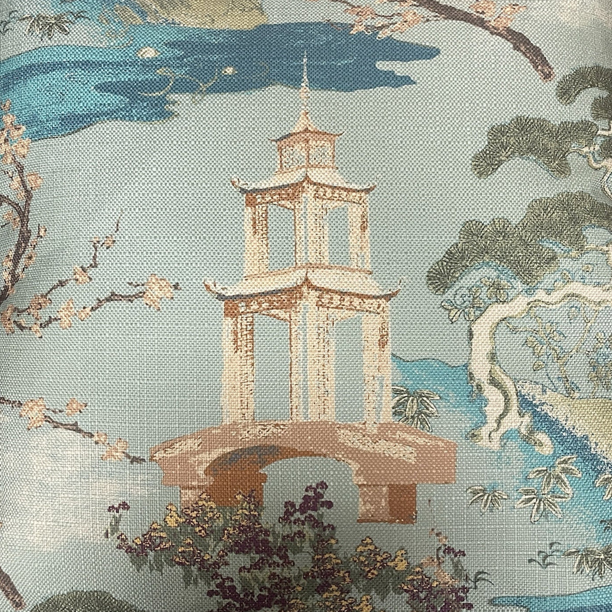 The Zen Pillow Seaspray 22 x 22 by Decor Fifty-Five features an Asian-inspired design with an embroidered pagoda, blooming trees, water, and landscape in blue, green, and beige linen.