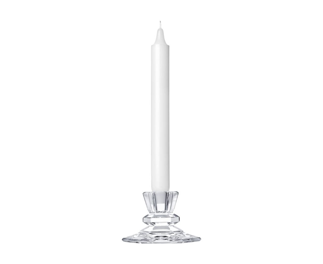 A clear crystal Saint-Louis/Hermes Jardy Candlestick - Small from Saint-Louis-lès-Bitche, France, holding a tall, slender white taper candle.