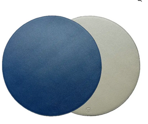 The Grained Faux Leather Reversible Placemats s/4 by Von Gern Home feature blue and light gray sides with a subtle pebbled texture, offering an elegant, leather-like look for your table setting.