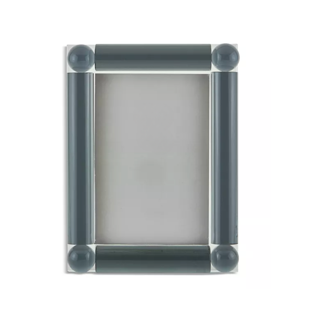The Tizo Corner Ball Crystal Frame Grey is a rectangular 5x7 photo frame with thick, dark grey cylindrical borders and rounded corners. Elegant and empty, it highlights its blank inner area against a white background.