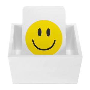 The Canasta Sets Canasta 2 Deck Holder is a white card holder displaying cards, with the front card showing a bold yellow smiley face—ideal for organizing or enhancing your Canasta card games.