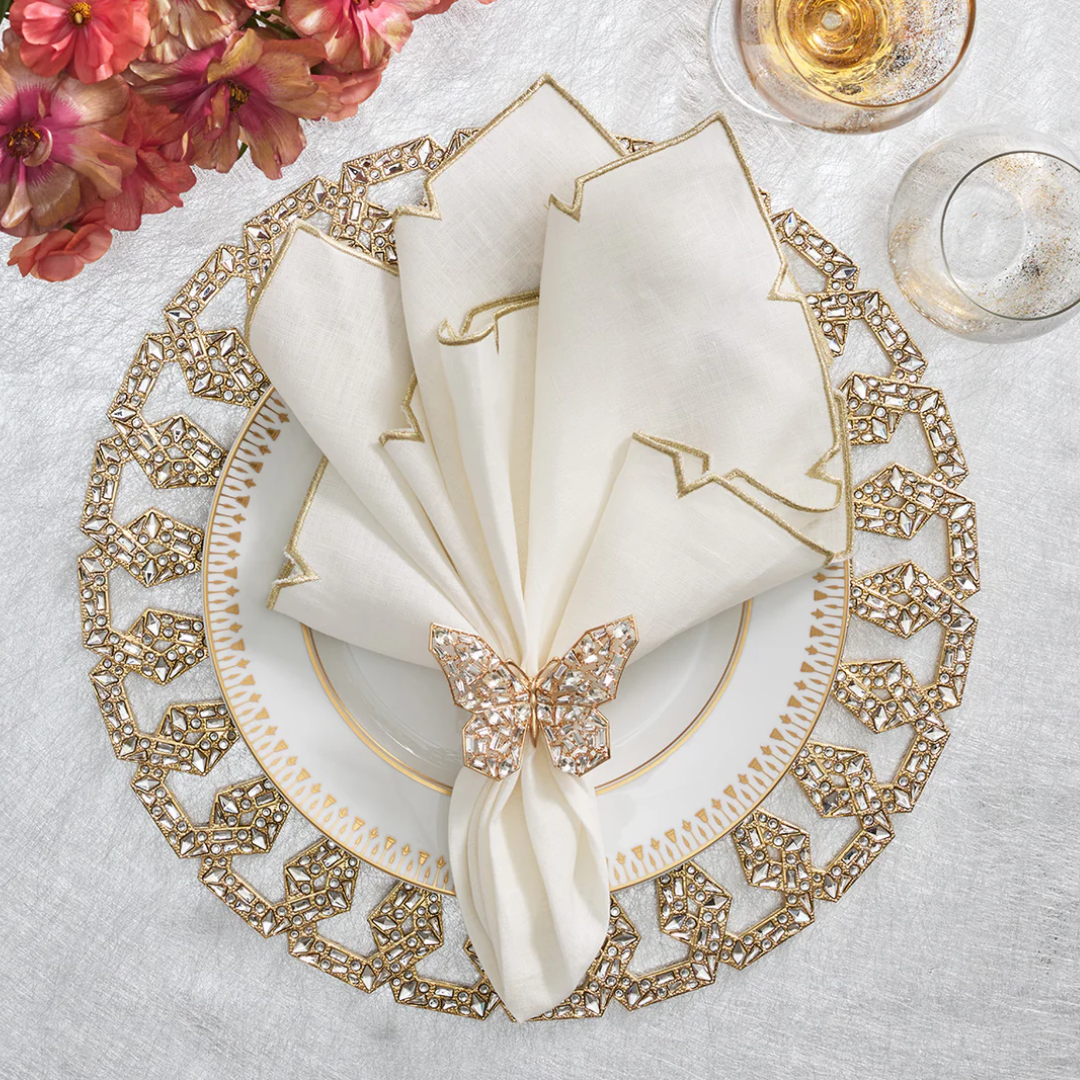 Papillion napkin ring displayed on a holiday table setting. 
