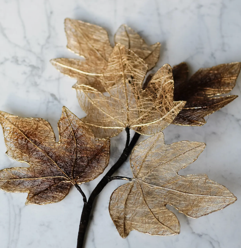 A Dekorasyon Maple Leaf Stem featuring four delicate, wire-like maple leaves in shades of metallic gold and brown, perfect for seasonal displays.