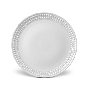 A beaded-rim charger plate from L'Objet's Perlèe White Dinnerware collection, shown on a white background.