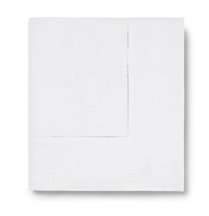 The Sferra Festival Tablecloth, featuring a subtle stitched border detail, is neatly displayed against a plain white background.