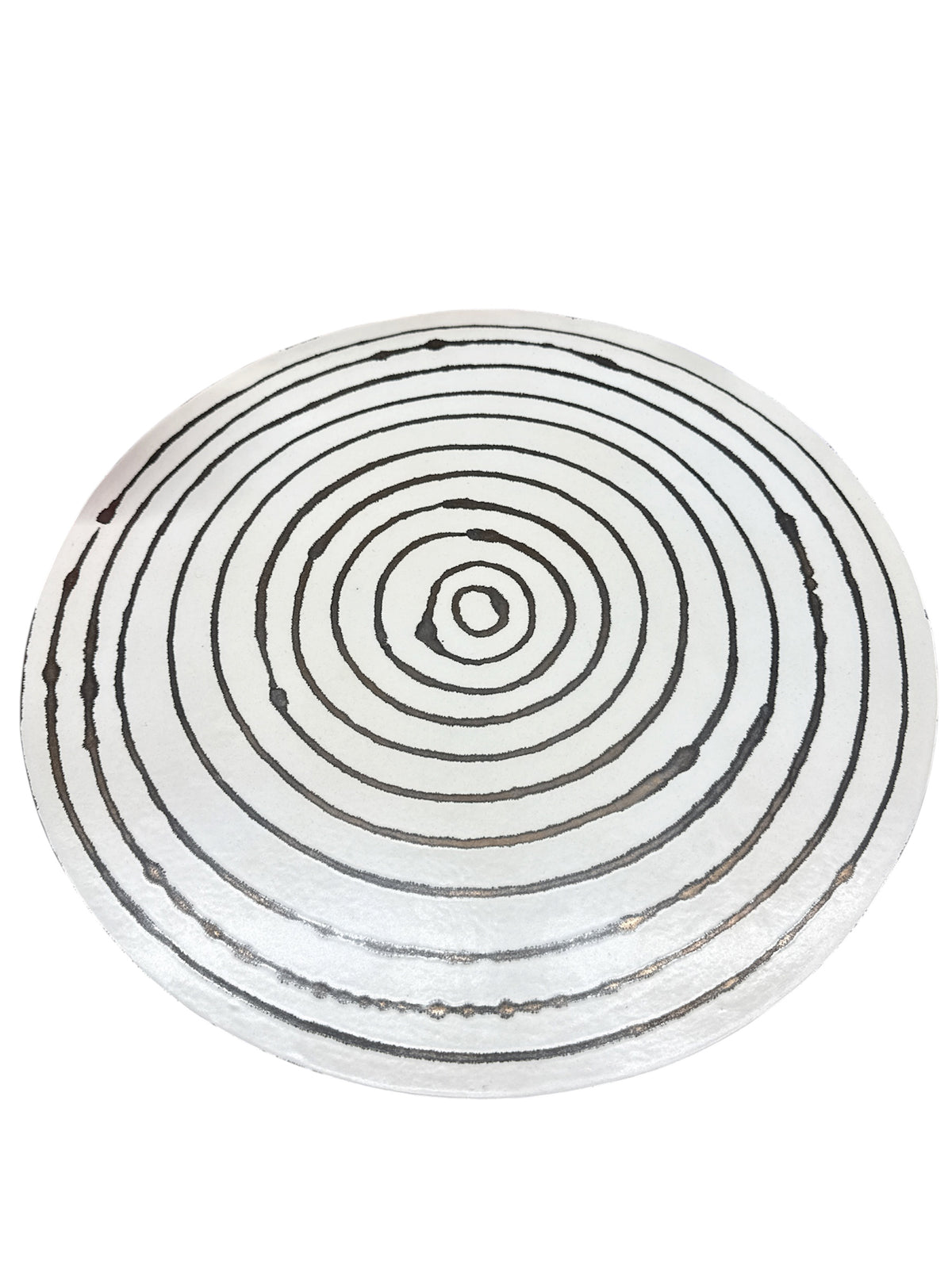 The Michael Wainwright Linea Lazy Susan - Medium features evenly spaced black concentric circles on a white background, hand painted in a design reminiscent of stylized tree rings or a target. This piece from the Linea collection brings modern elegance to any space.