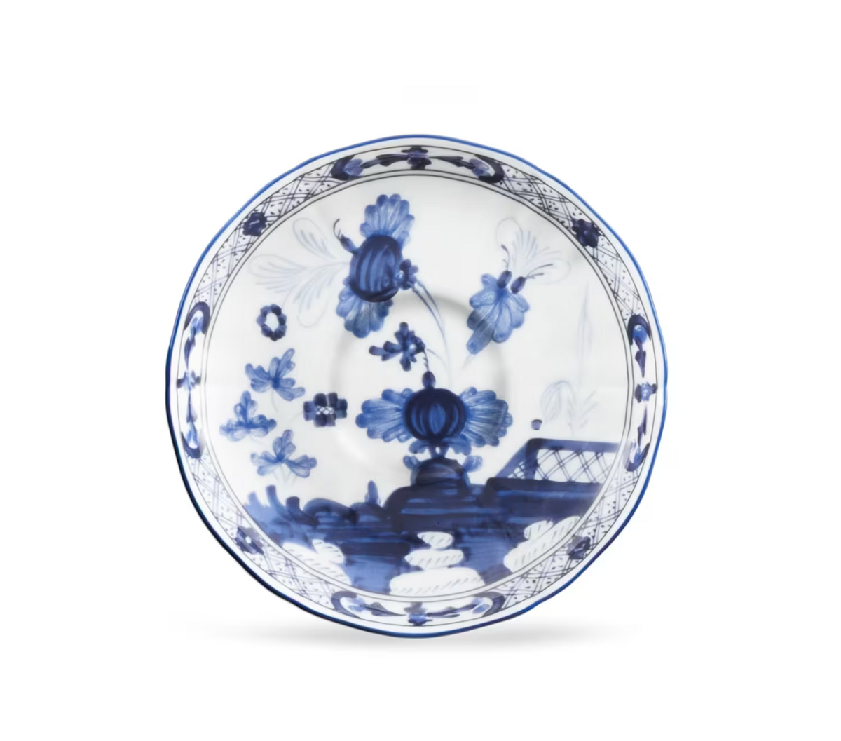 Ginori 1735 Oriente Italiano Indaco - white porcelain saucer decorated with blue floral patterns and a lattice border.