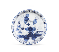 Ginori 1735 Oriente Italiano Indaco - white porcelain saucer decorated with blue floral patterns and a lattice border.