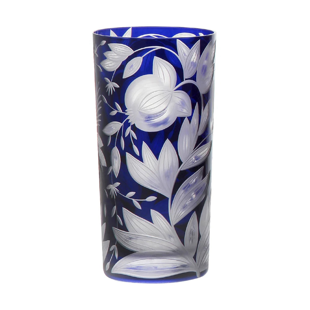 Deep blue Artel Verdure Highball Jewel Colors glass featuring an intricate, etched botanical design of pomegranates and leaves.
