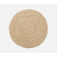 Emmy Round Placemat S/4 - Natural, a round, coiled, woven fiber placemat.