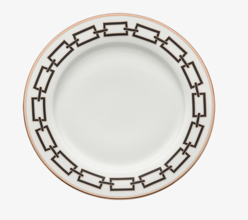 A Catene Nero Dinnerware plate by Ginori 1735, featuring white ceramic with a gold rim and a striking geometric black pattern around the edge, shown from above on a white background.