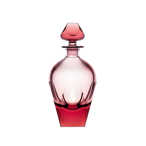 The Moser Bar Decanter 750 ml is an elegant pink-tinted glass bottle with smooth curves, faceted edges, and a matching geometric stopper, reminiscent of luxury barware, displayed against a white background.
