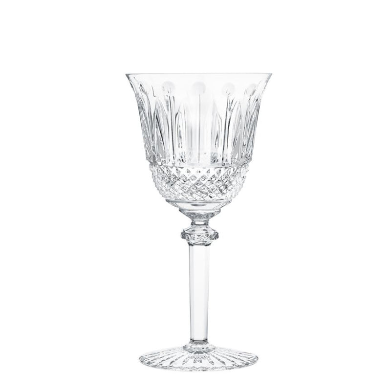 The Saint-Louis Tommy Stemware is a clear crystal wine glass with intricate cut-glass patterns on the bowl and base, a slender stem, and is displayed empty against a plain white background.