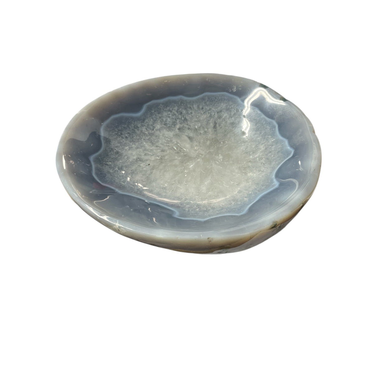 The Agate Bowl Brazil CH2796 Blue Chico 1 by Verona Prive is a shallow, round agate dish with a glossy finish, showcasing layered gray, blue, and white bands plus a crystalline center.