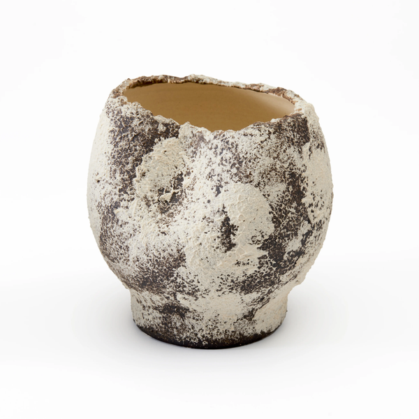 Textured ceramic cup on a white background