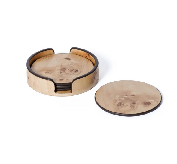The Zodax Valari Burl Veneer Coaster Set of 4 features round coasters with a natural wood grain finish and a matching holder with an open side for easy access; one coaster is displayed outside the holder.