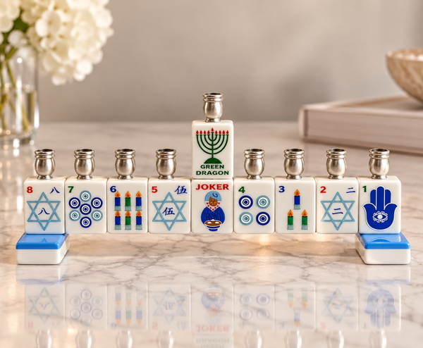 The Mah Jong Menorah - Traditional- Blue features nine tiles in a row, each with a metal candle cup and decorated with game symbols, stars of David, a hamsa, and a green dragon design.
