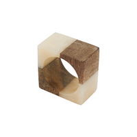 The Two Tone Cube Napkin Ring Set of 4 by Saro Trading features alternating light cream and dark brown wood with a round center—perfect for minimalist décor.