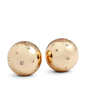 Two gleaming, platinum, spherical salt and pepper shakers adorned with star-shaped patterns and Swarovski crystals from the Stars Spice Jewels Salt & Pepper Set by L'Objet sit side by side on a white background.