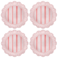The Juliska Cabana Stripe Melamine Dinnerware Set of 4 in Coral features round plates with ruffled edges and vertical pink and white stripes, arranged in a grid on a white background.